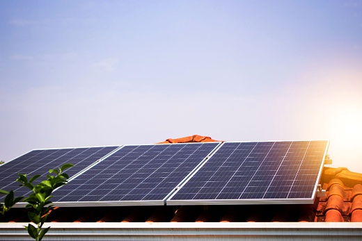 Solar panels generating electricity under cloudy skies in Malaysia