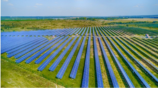 Large-scale solar farm with rows of photovoltaic panels